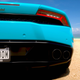 A Lambo Huracan parked on a beach at noon in Forza Horizon 5 on Xbox Series X.